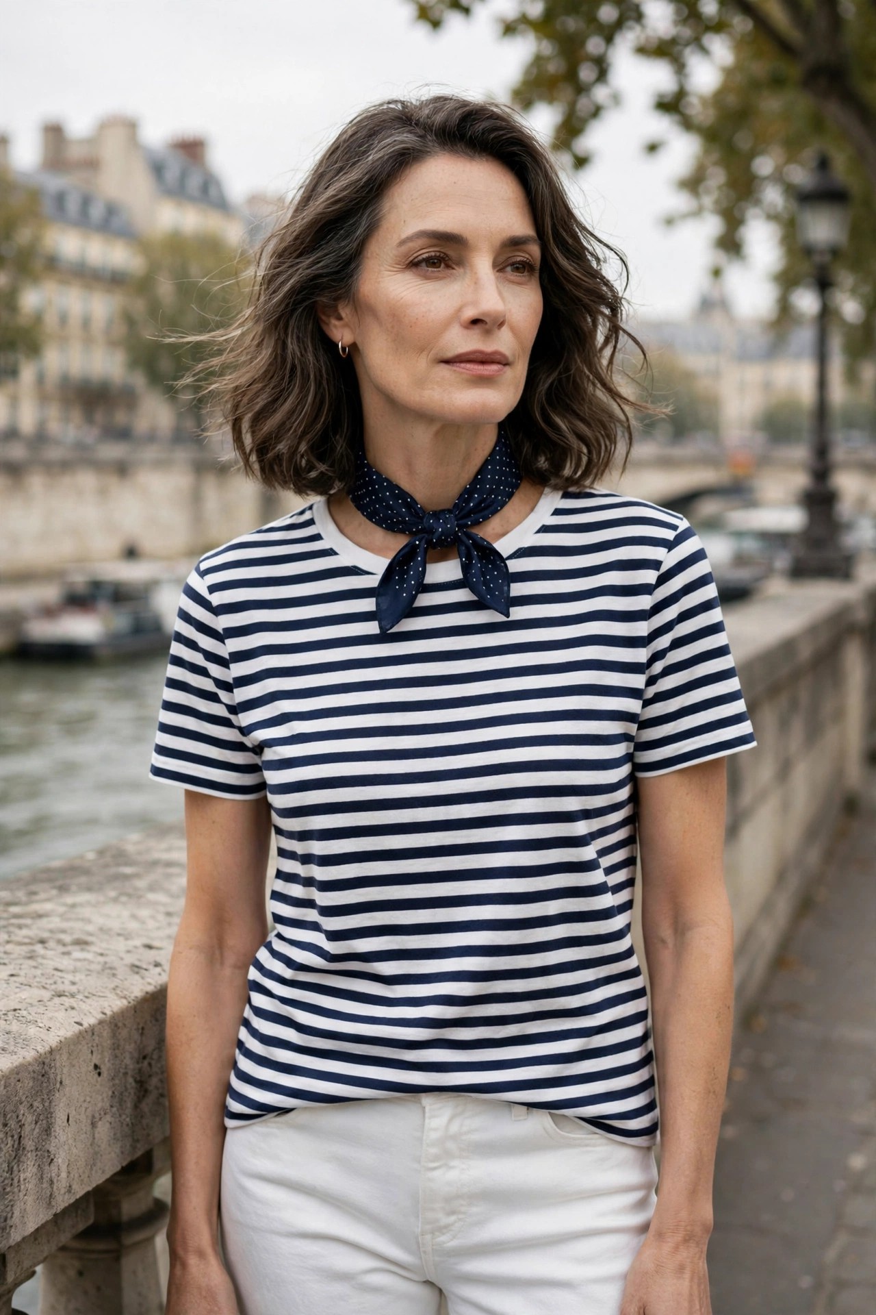 Mature woman in a striped Breton tee with a navy polka-dot silk neckerchief