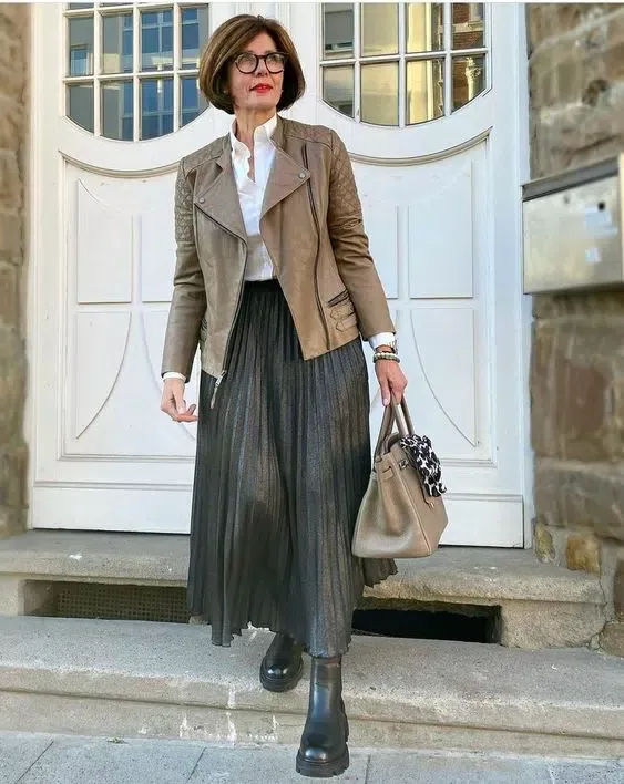 Leather bomber jacket with satin midi skirt and heeled boots