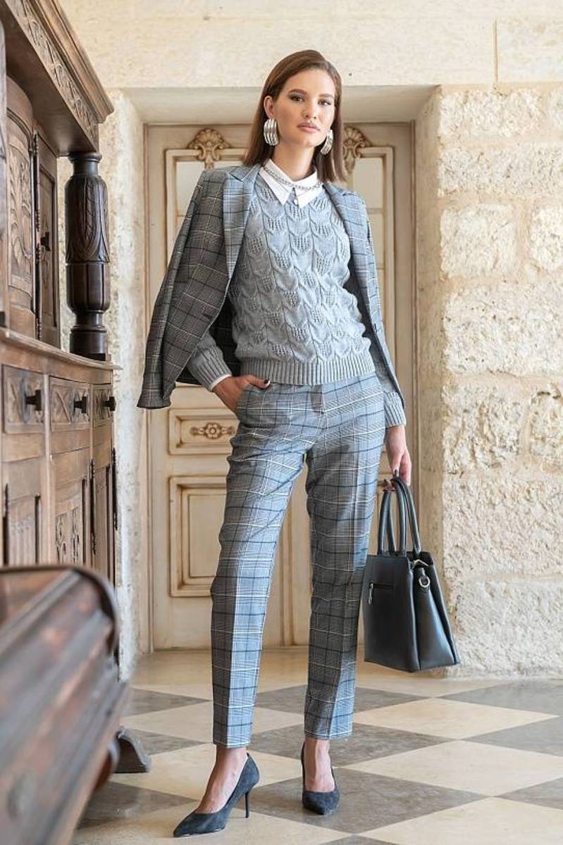Cable knit sweater with plaid blazer and slim trousers