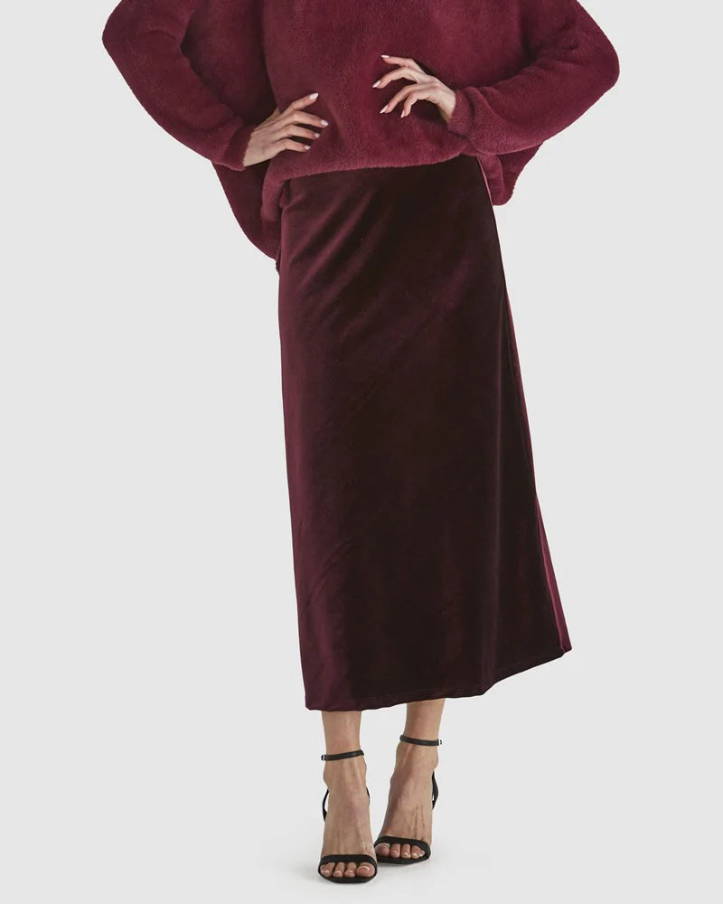 Burgundy sweater with dark velvet midi skirt and heels