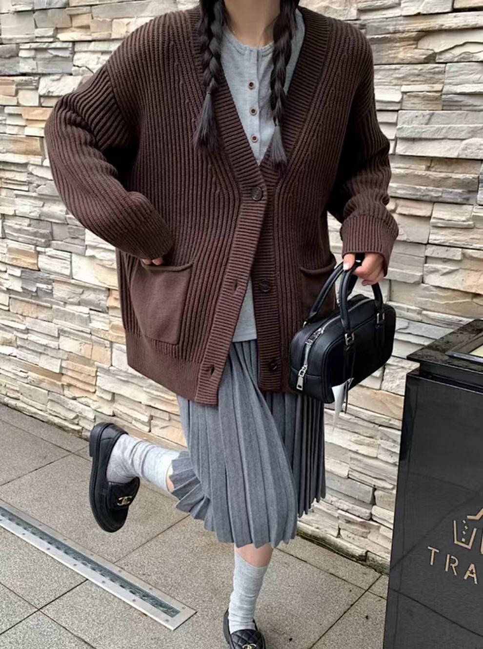 Woman over 50 wearing a short-sleeve cardigan over a tee with a midi skirt