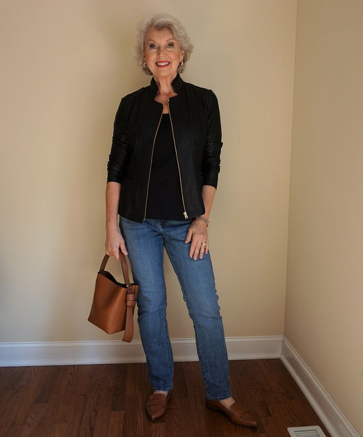 Woman over 50 in silk camisole cardigan and leather jacket outfit