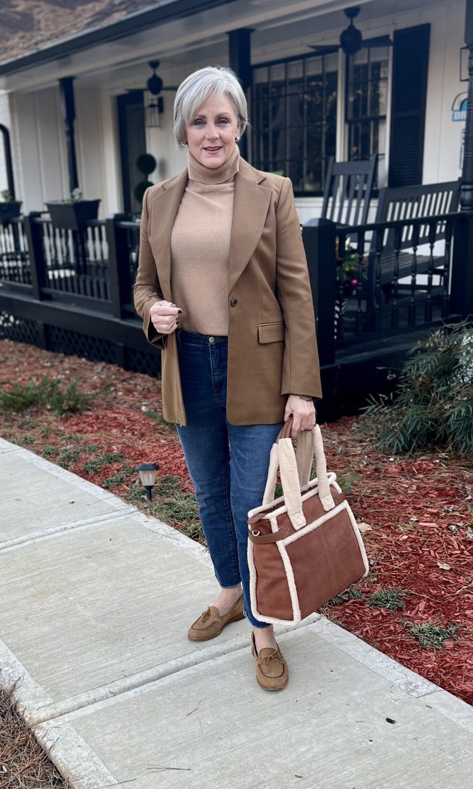 Camel blazer with black turtleneck and jeans for lunch outfit woman over 50