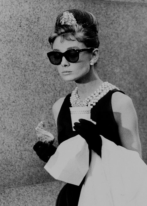 Holly Golightly halloween costume with little black dress sunglasses and pearls