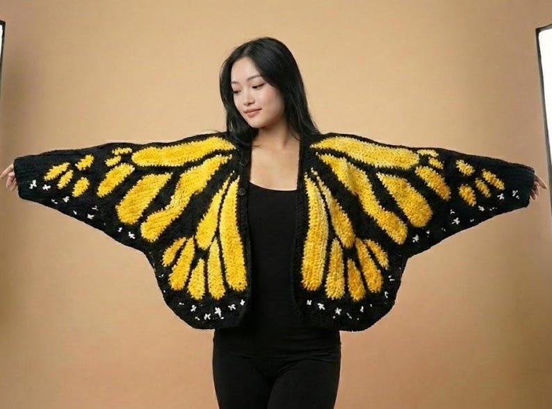 Social butterfly halloween costume with bright cardigan and paper butterflies