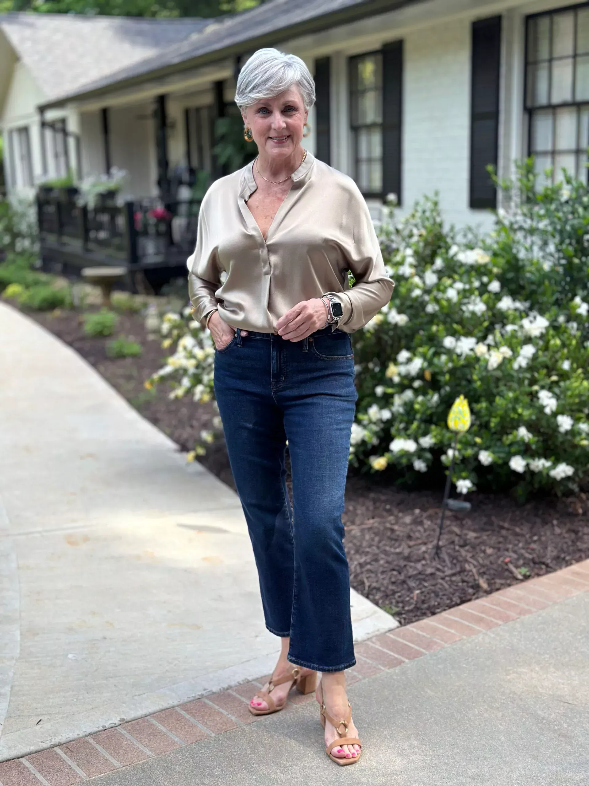Champagne satin blouse with dark jeans and loafers, outfit idea for women over 50