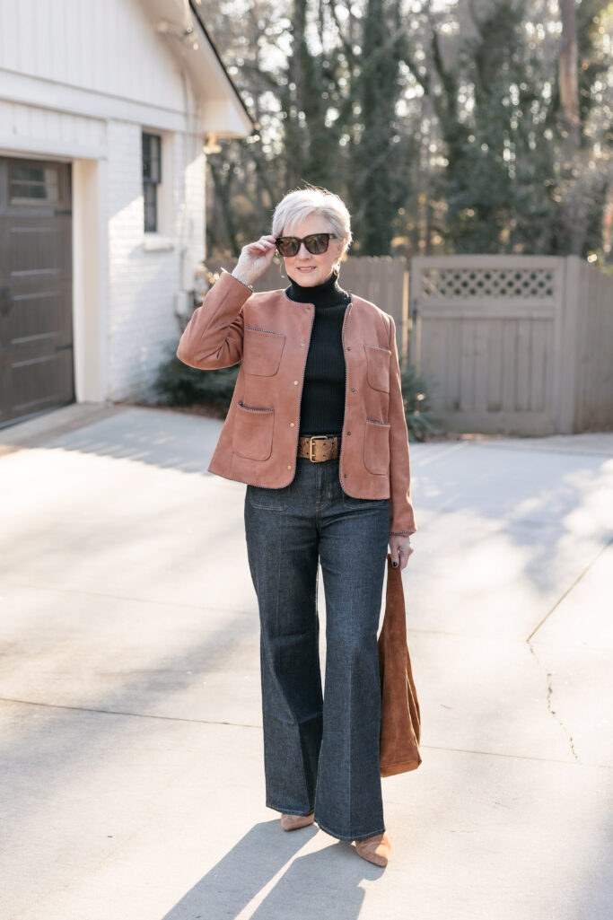 Suede jacket with cream turtleneck and dark jeans fall outfit