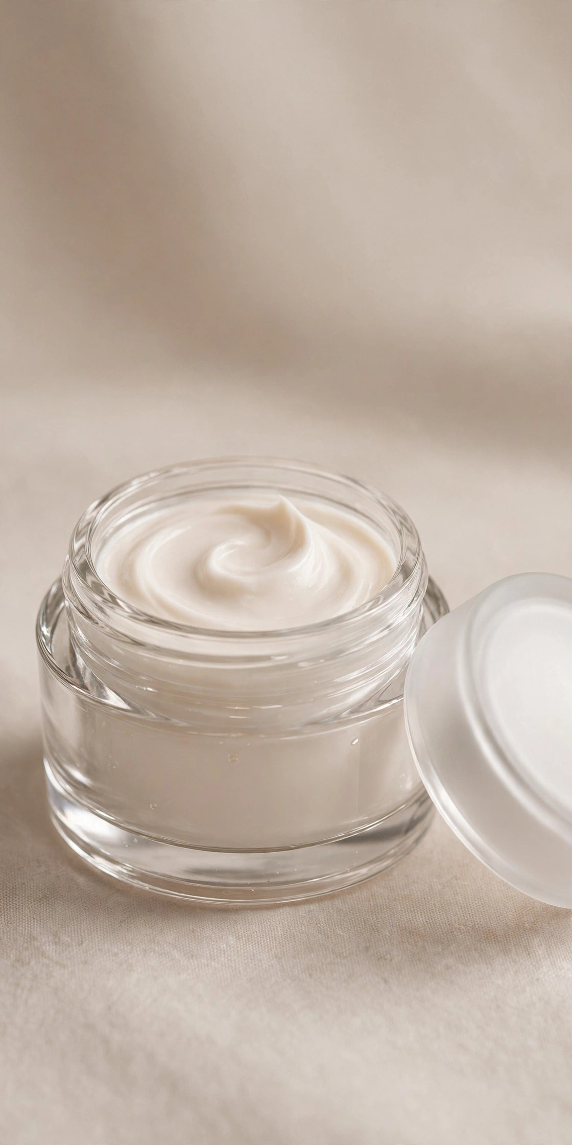 Open glass jar of rich ceramide barrier cream