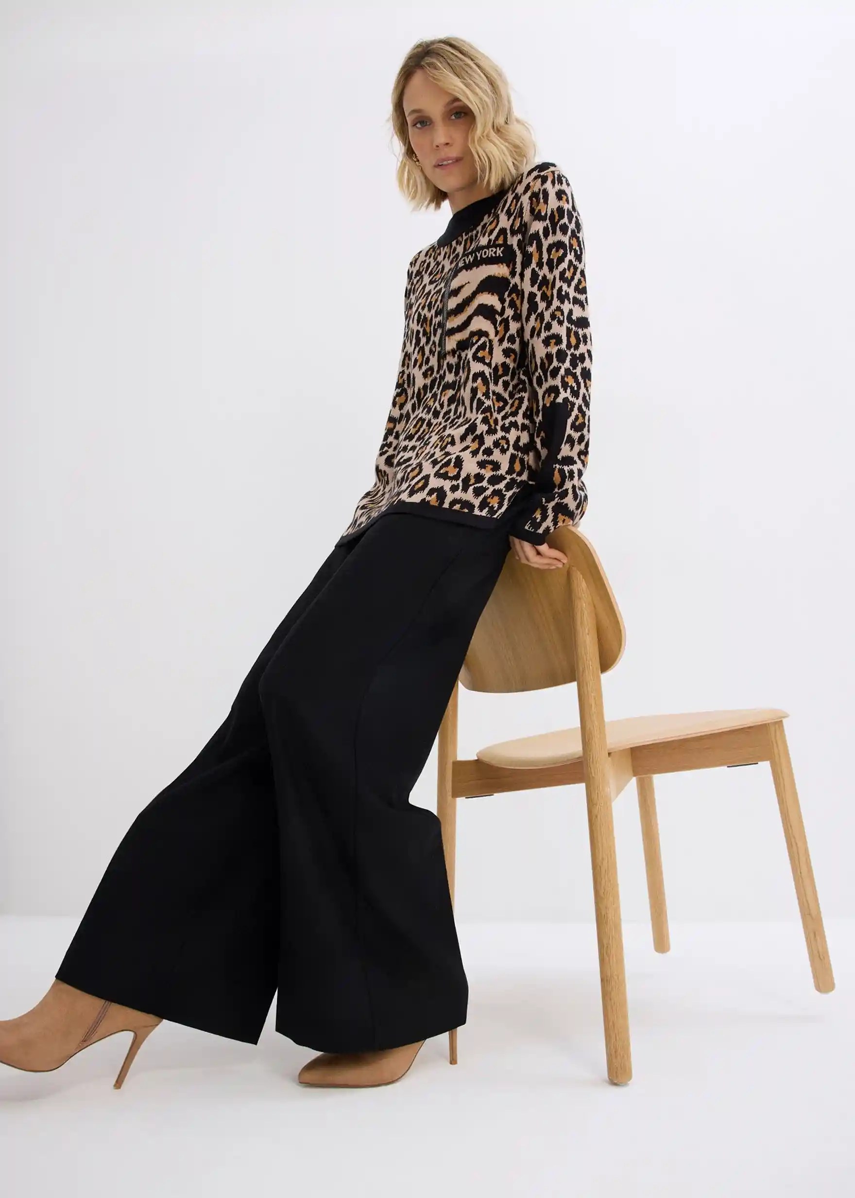 Black wide-leg trousers with leopard sweater and ankle boots — chic fall outfit
