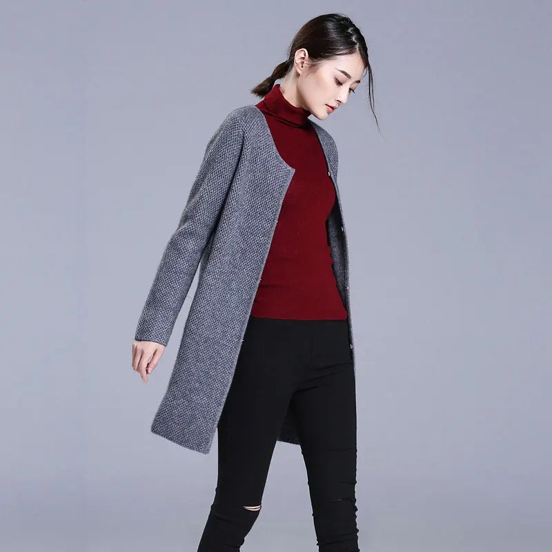 Red turtleneck with grey cardigan and black trousers — warm fall outfit for women over 50