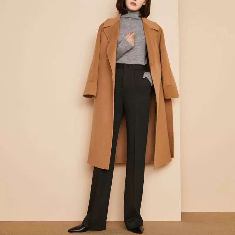 October outfit idea 19: camel wool coat grey turtleneck black trousers on a woman over 50