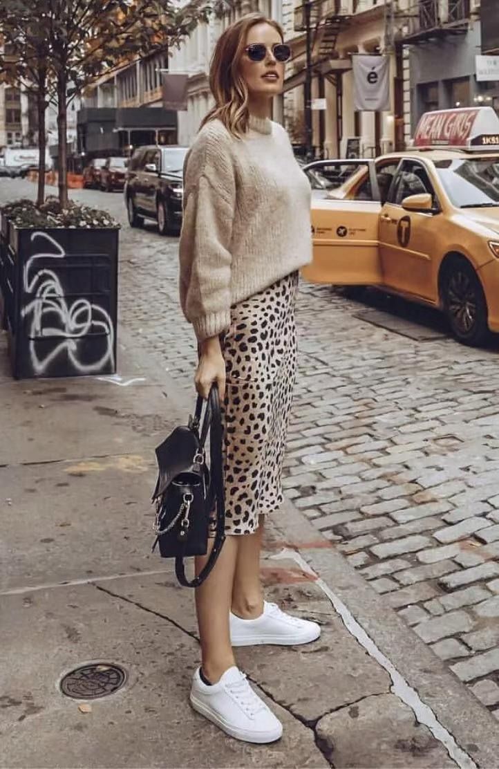 October outfit idea 5: chambray shirt leopard midi skirt white sneakers on a woman over 50