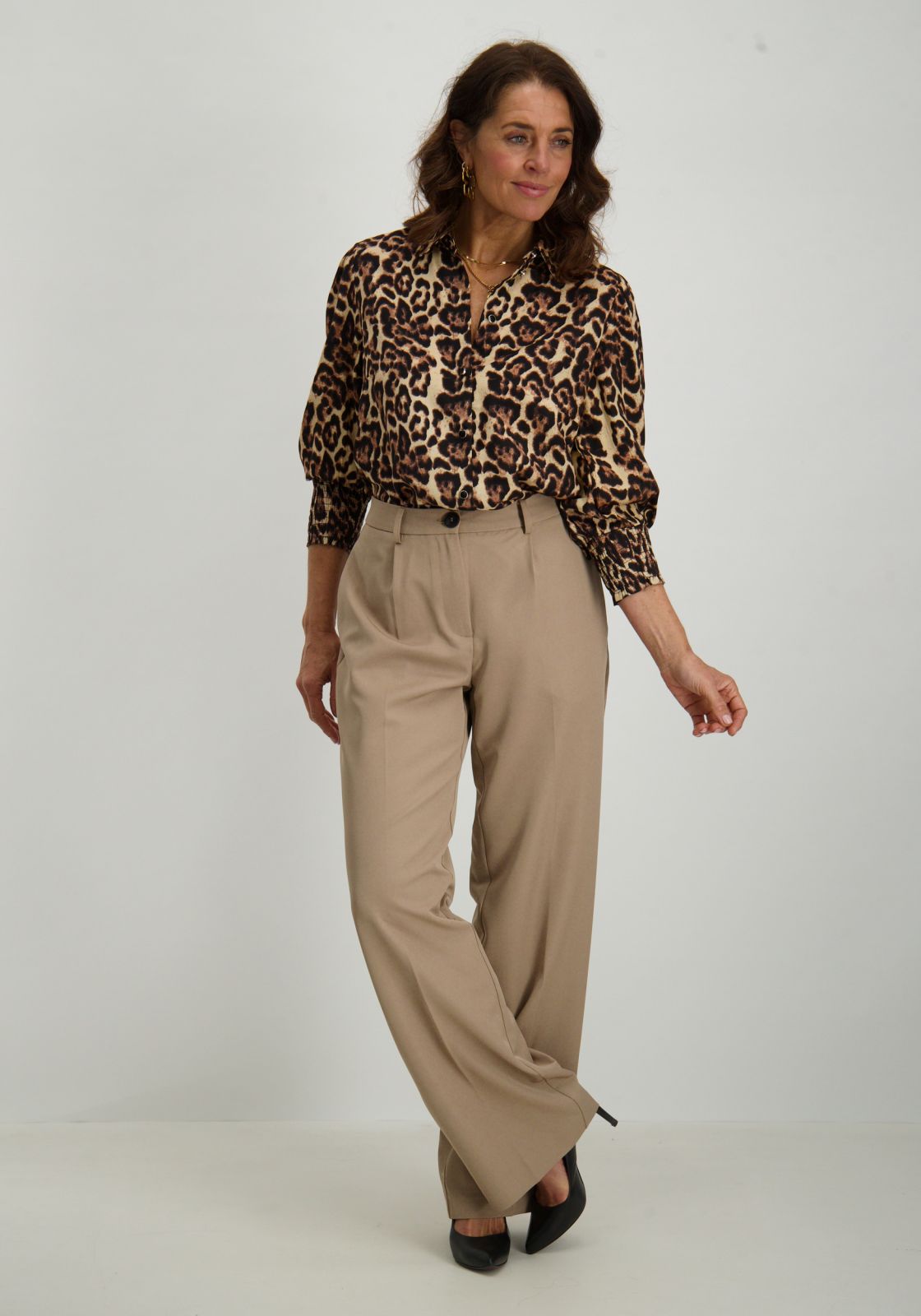 Olive wide trousers with leopard print blouse and gold hoop earrings, fall outfit