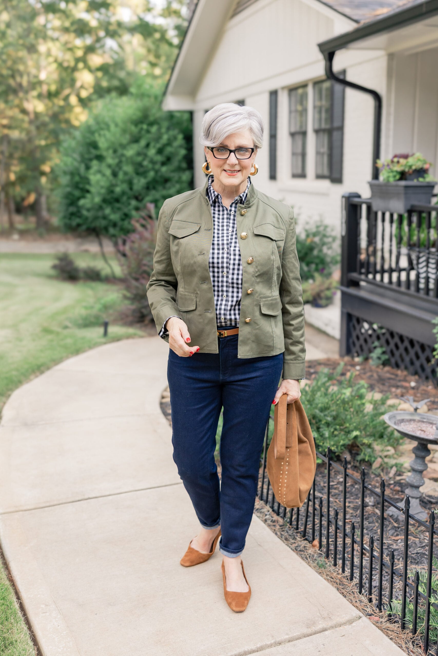 Olive canvas barn jacket over navy sweater with dark jeans, weekend fall outfit
