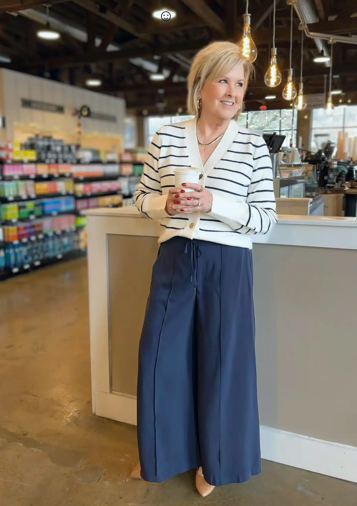 Olive cardigan with navy and cream striped tee and navy trousers, classic outfit