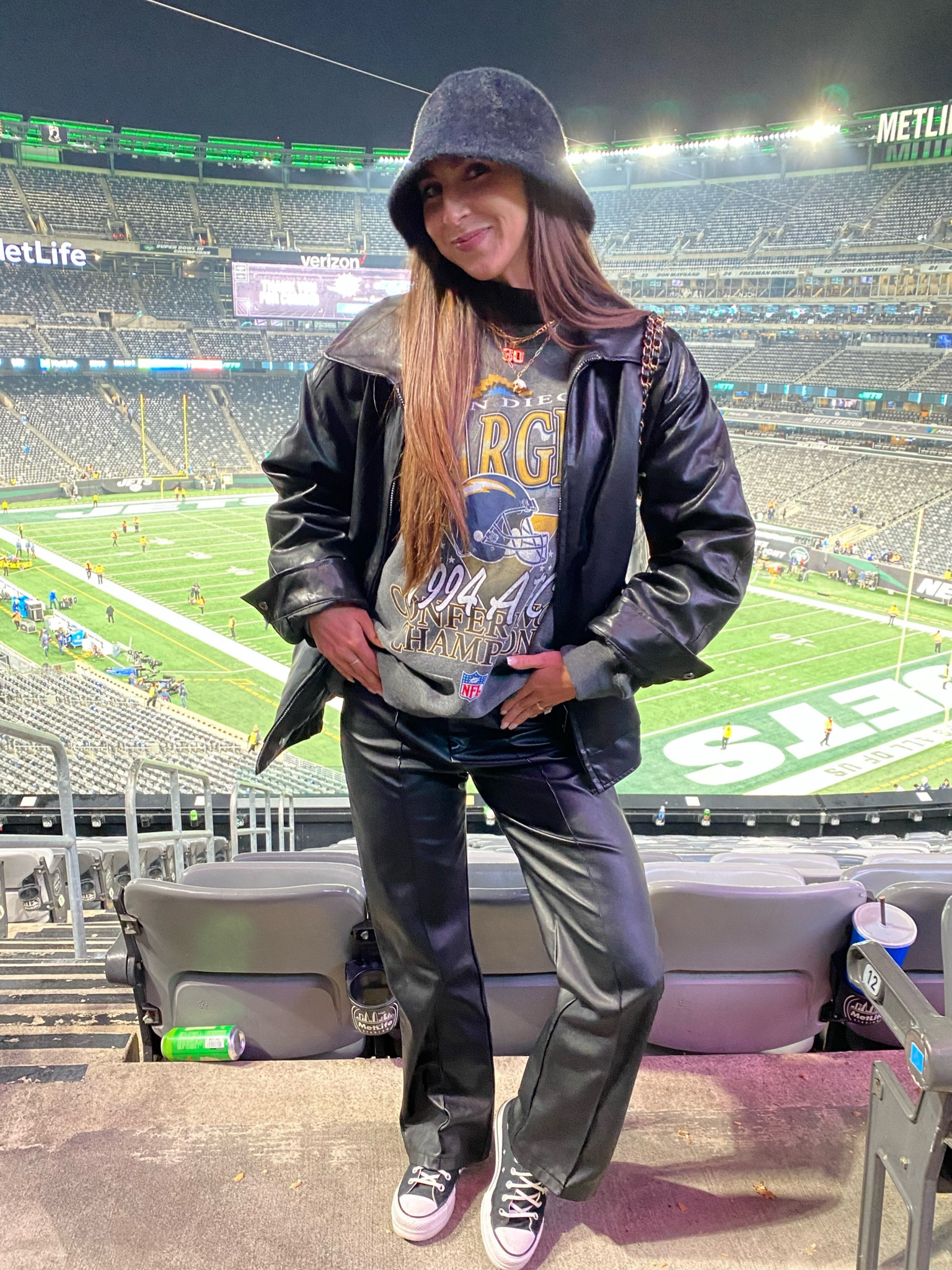 Night Game: Black Puffer + Gold Beanie + Black Leggings - outfit idea for women over 50