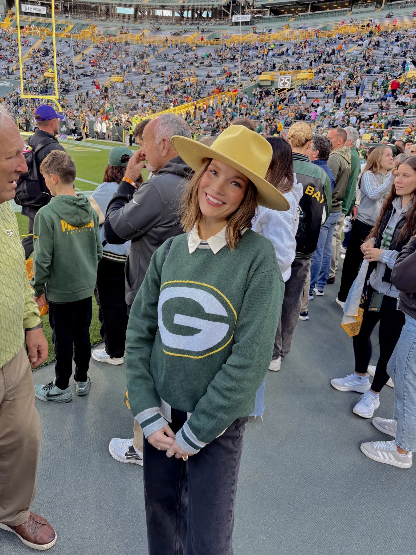 Night Game: Green Barn Jacket + Cream Fisherman Sweater + Gold Scarf - outfit idea for women over 50