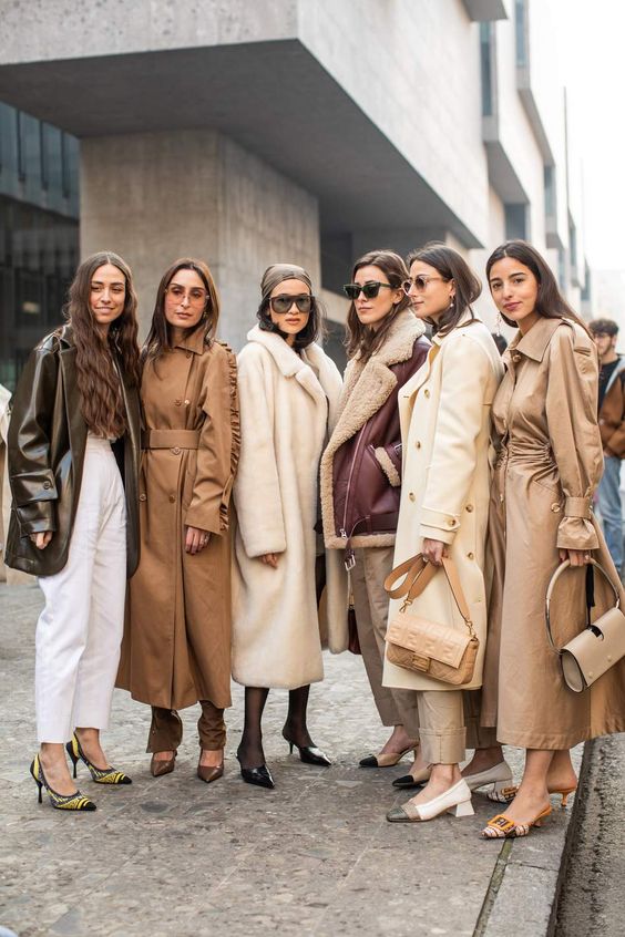 Group of women in cream, camel and brown fall outfits for pumpkin patch photos