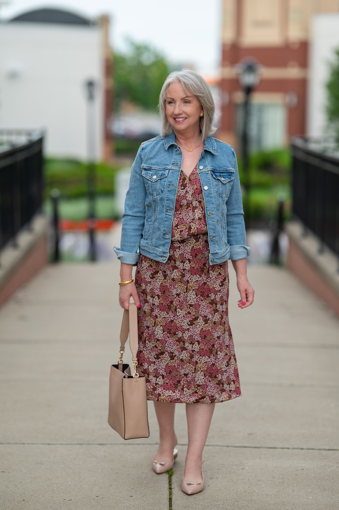 Tweed jacket over floral midi dress with mules, woman over 50