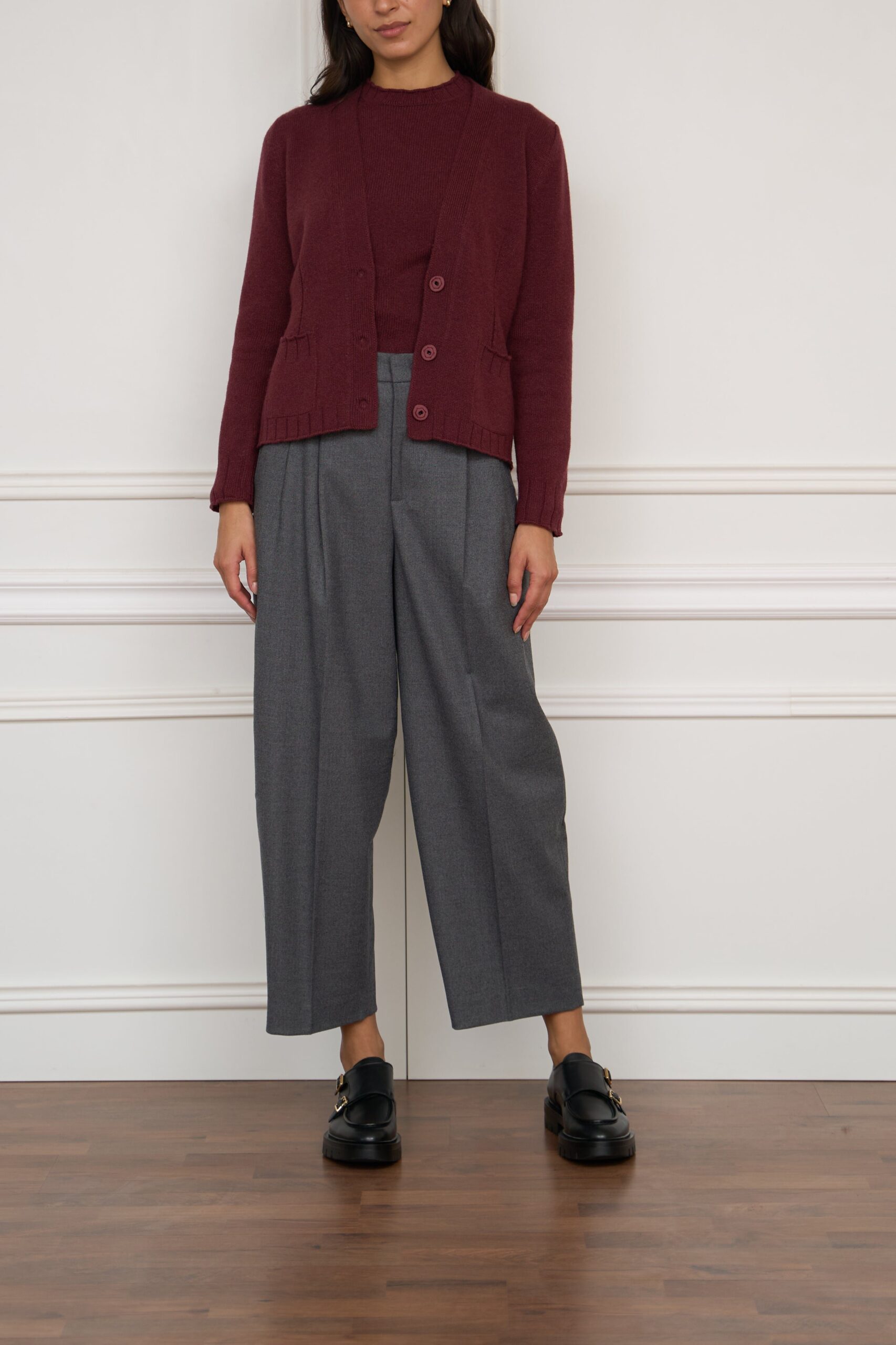 Burgundy twinset with grey wide trousers and loafers — elegant outfit for women over 50