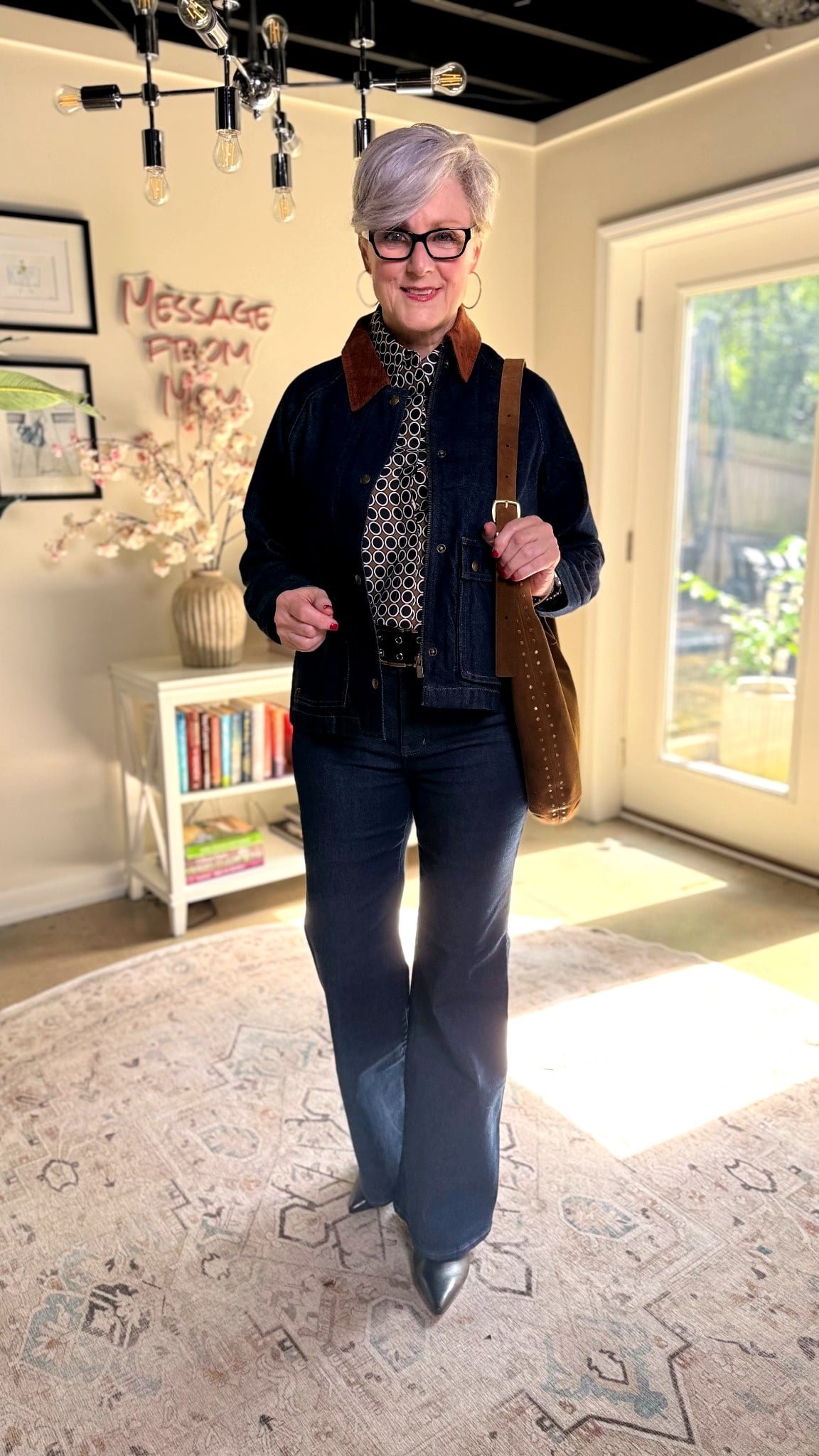 Belted utility jacket with slim jeans and knee boots, woman over 50