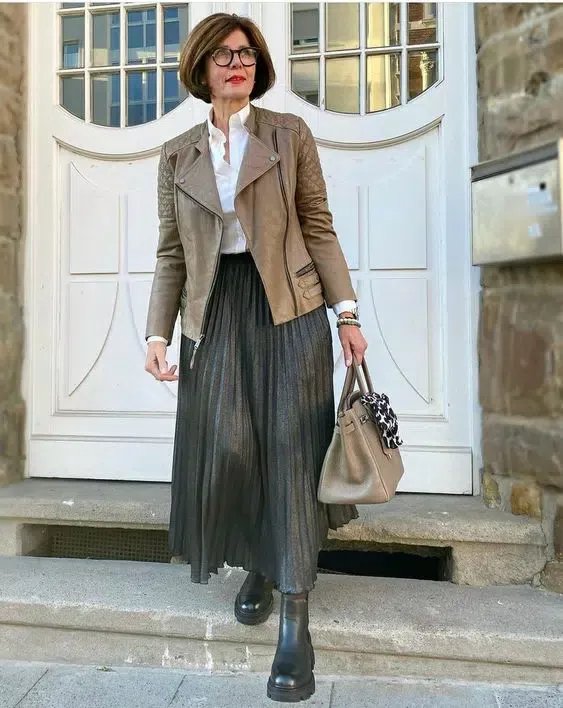 Utility jacket with satin skirt and heeled boots, woman over 50