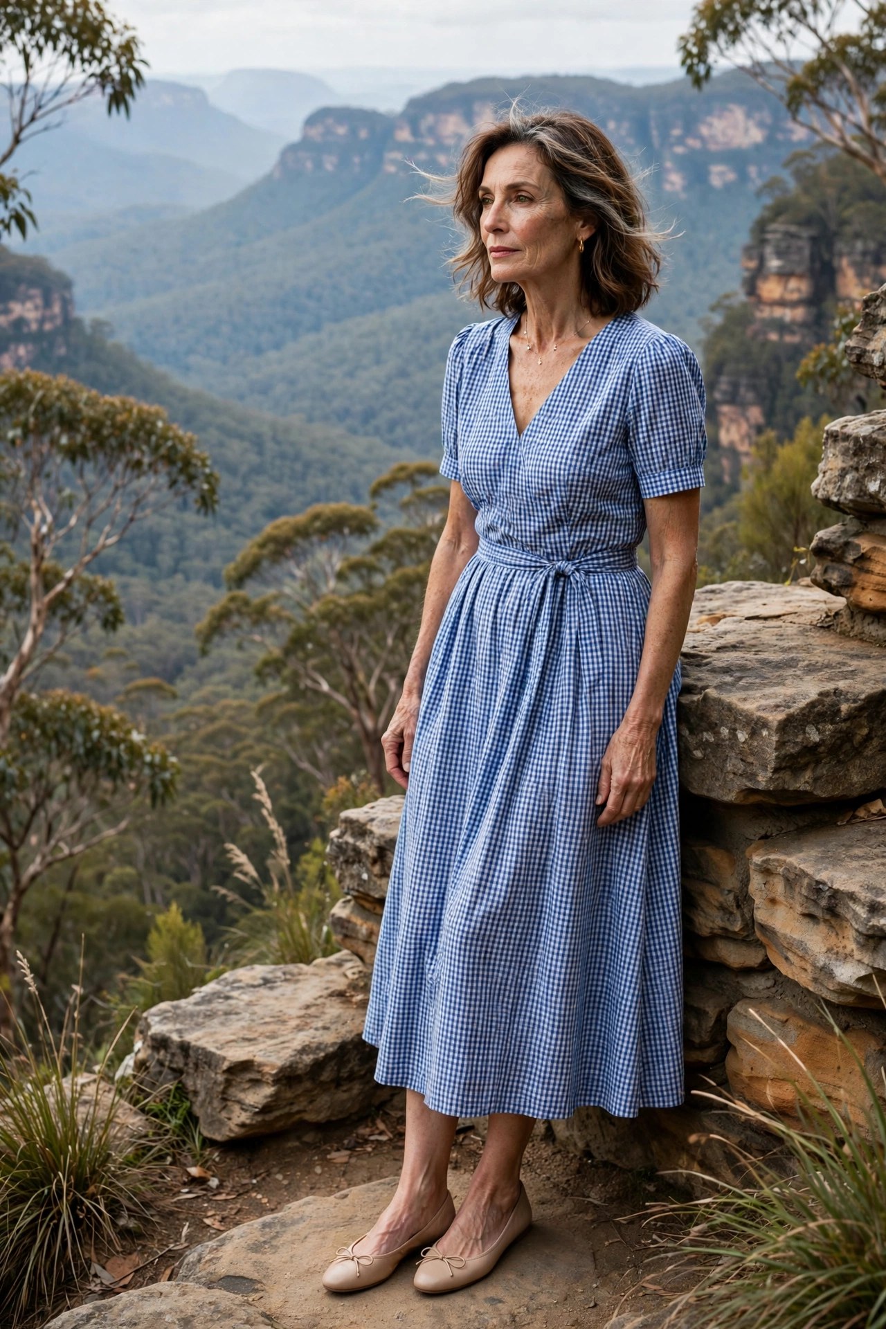 Woman in her 50s wearing a gingham midi dress and ballet flats in the Blue Mountains